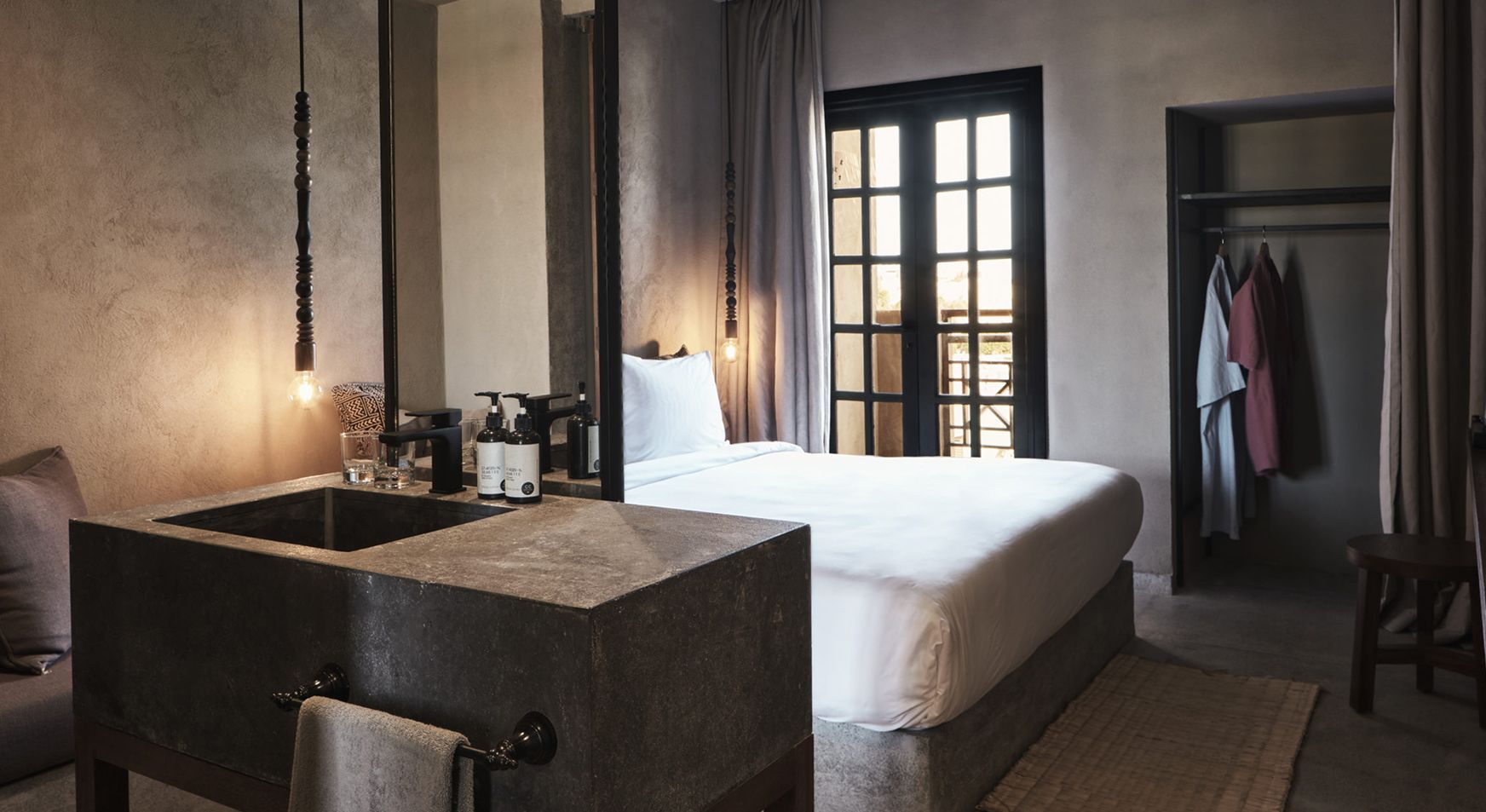 Cook’s Club Hotel bedroom with an open bathroom and wardrobe