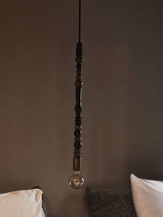 Suspended pendant light above the bed